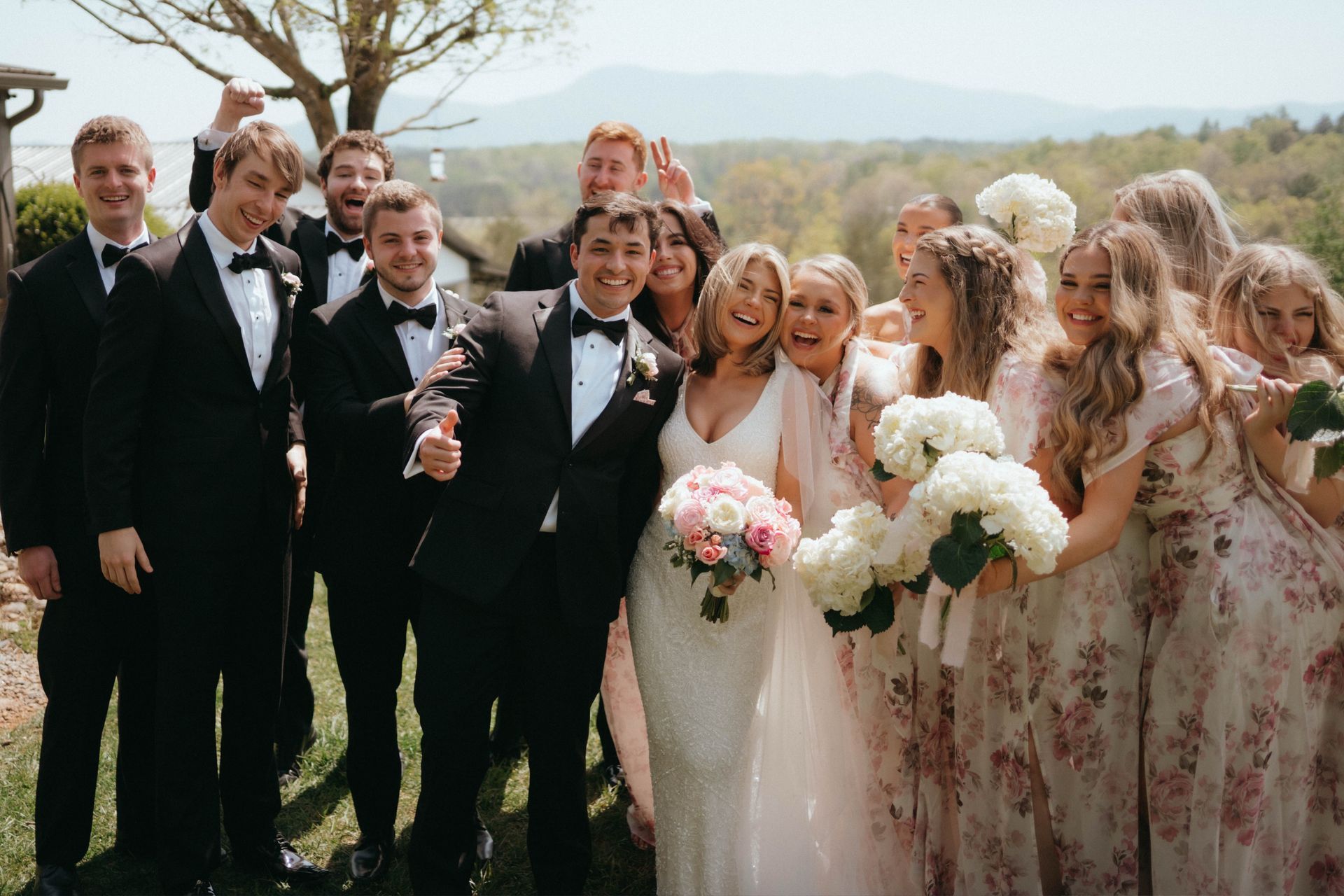 Bride and groom celebrating with wedding guests after outdoor ceremony in the Blue Ridge Mountains