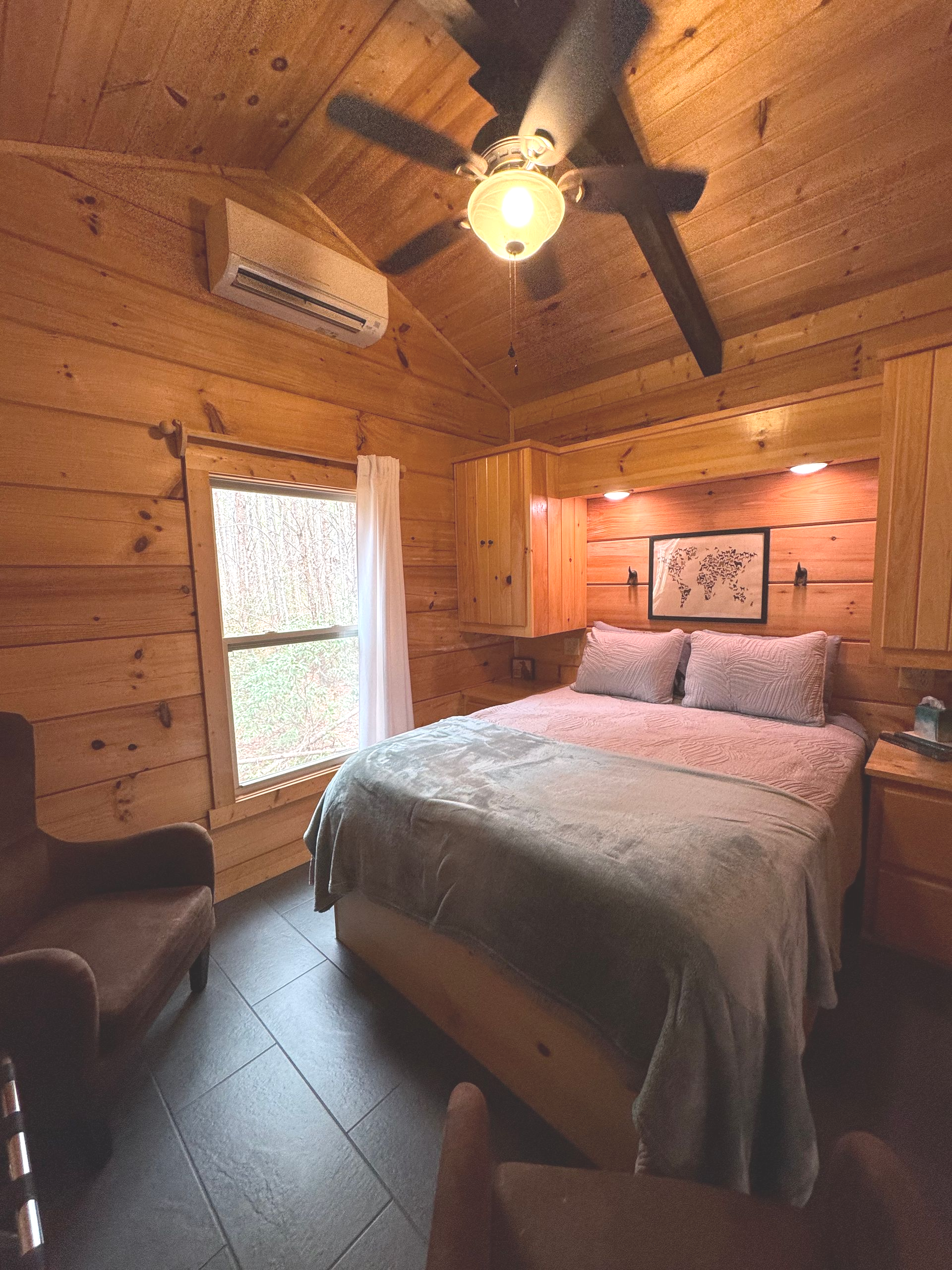 Cozy bedroom inside Cabin D for wedding guests staying at Serenity Ridge mountain venue