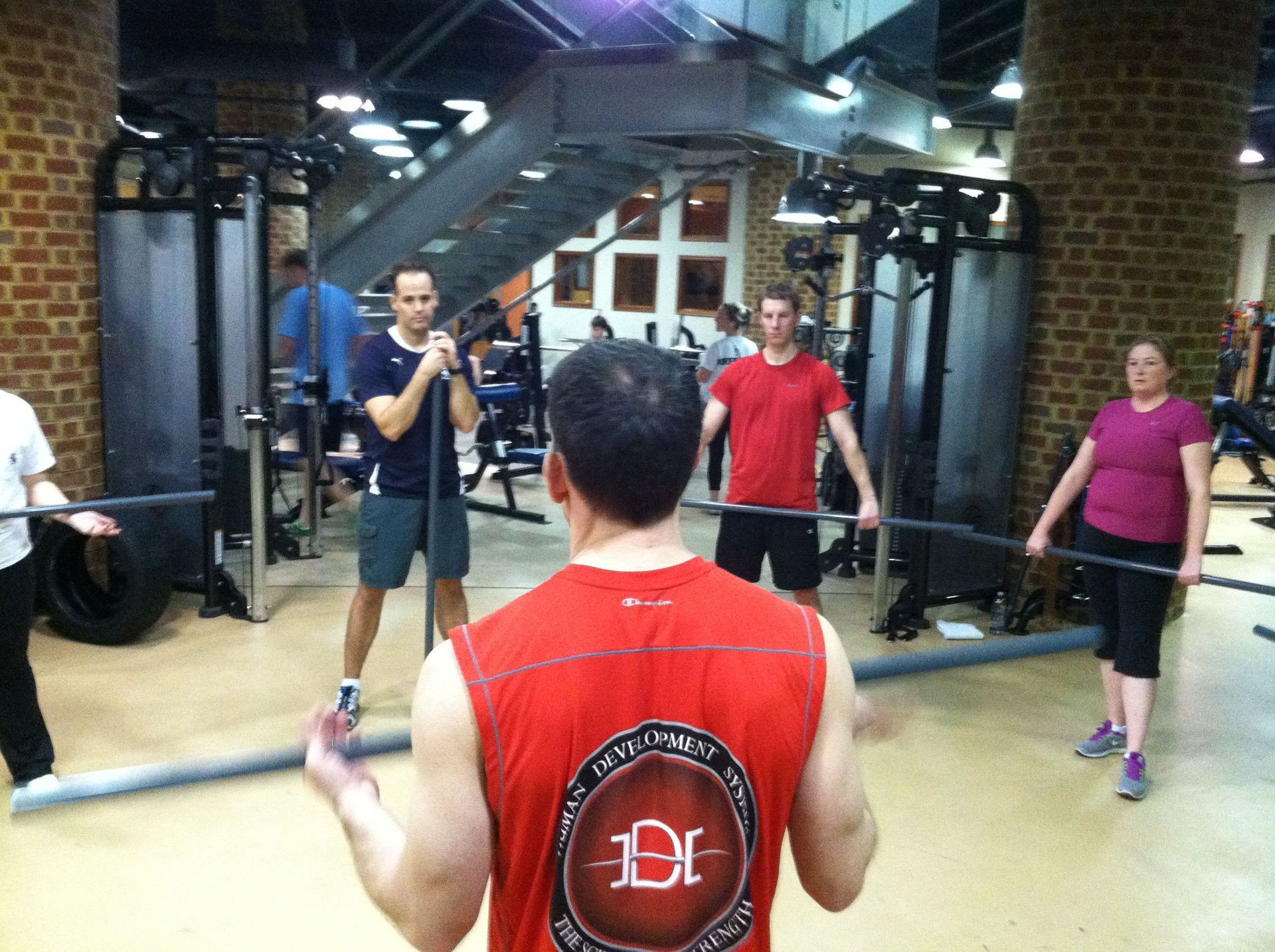 A man in a red tank top with the letter d on it