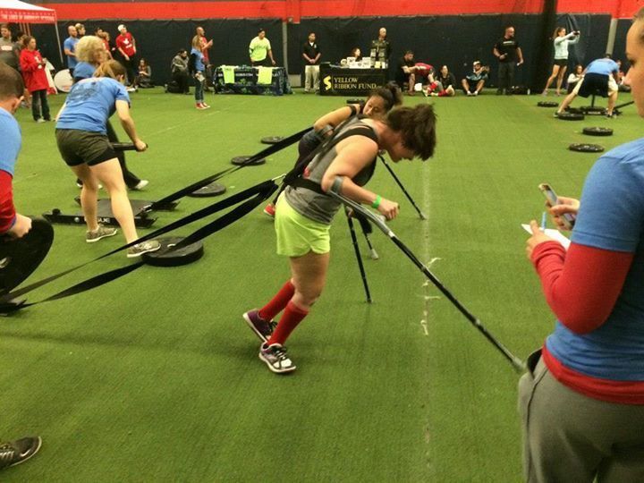 A group of people are doing exercises in a gym