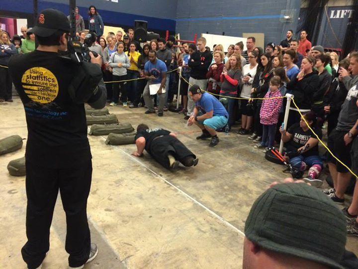 A man in a black shirt with the word lift on it
