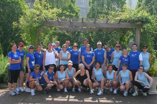 A group of people wearing blue shirts with the letter k on them