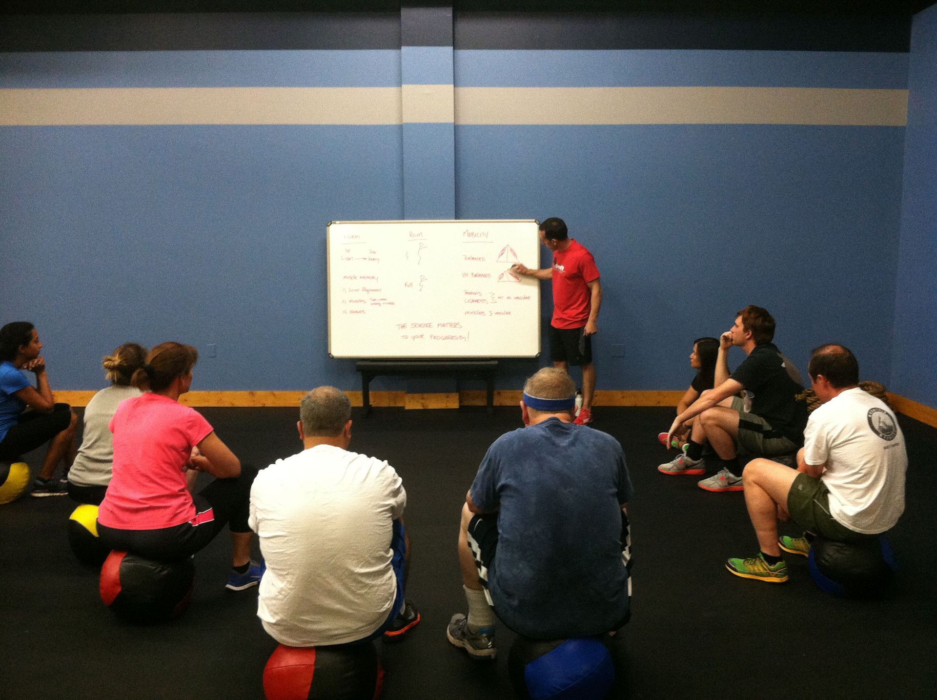 A man is giving a presentation to a group of people