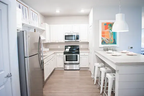 a living room filled with furniture and a ceiling fan .