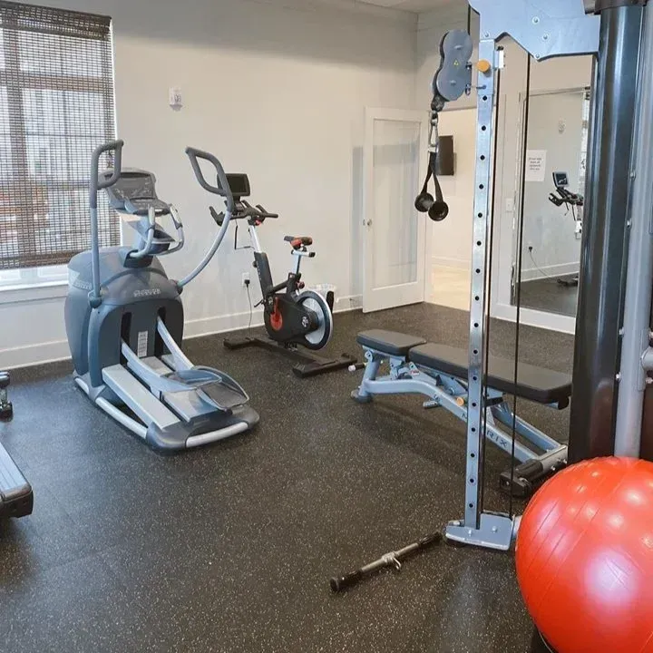 a gym with a red ball in the middle