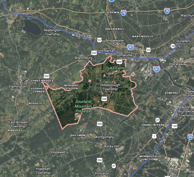 Satellite map outlining Saranac Lake area with a pink border around a dark green forested region