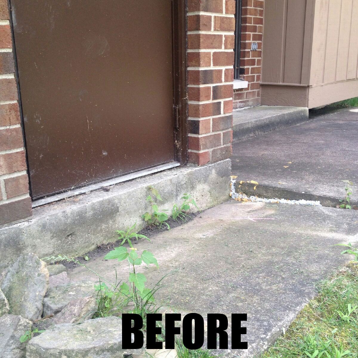 A before picture of a brick building with a door