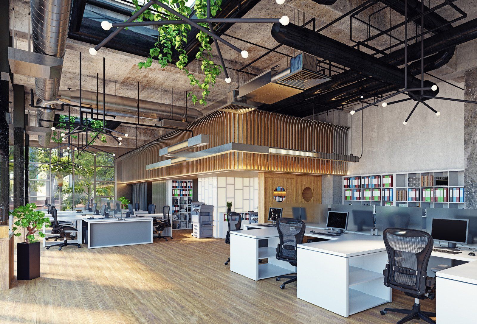 Modern office interior with workstations, plants, and a light-filled space.