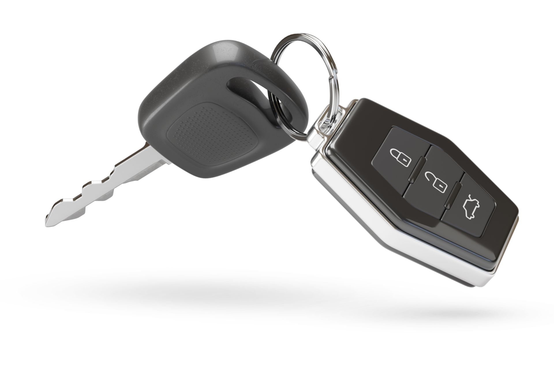 Car key and remote control, silver ring, black buttons, white background.