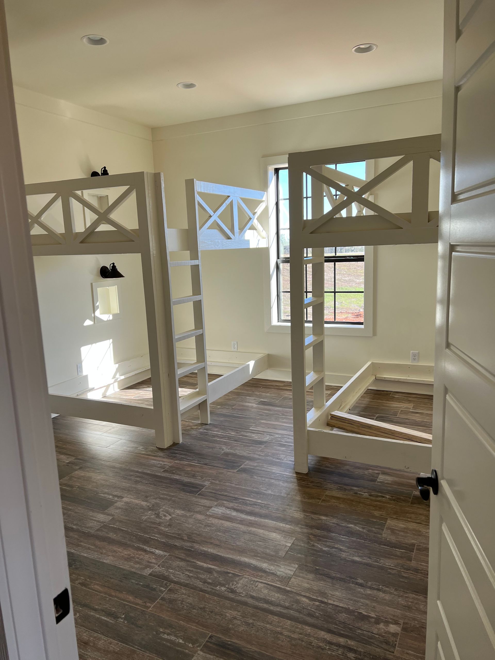 Custom-built bunk beds painted white by Covington Painter