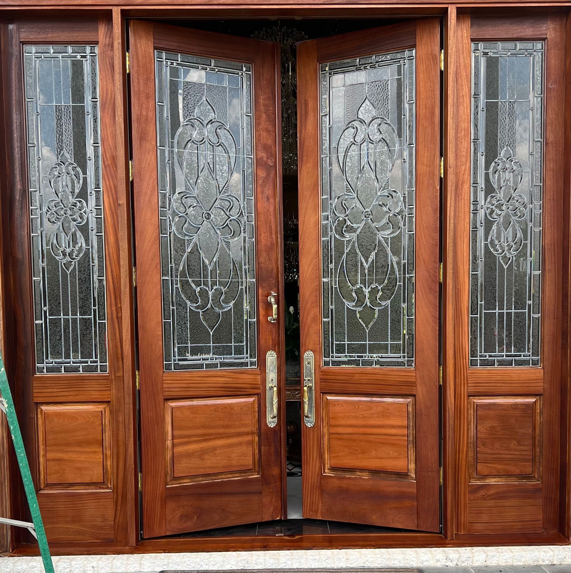 Front door sanded down and restained by Covington Painter