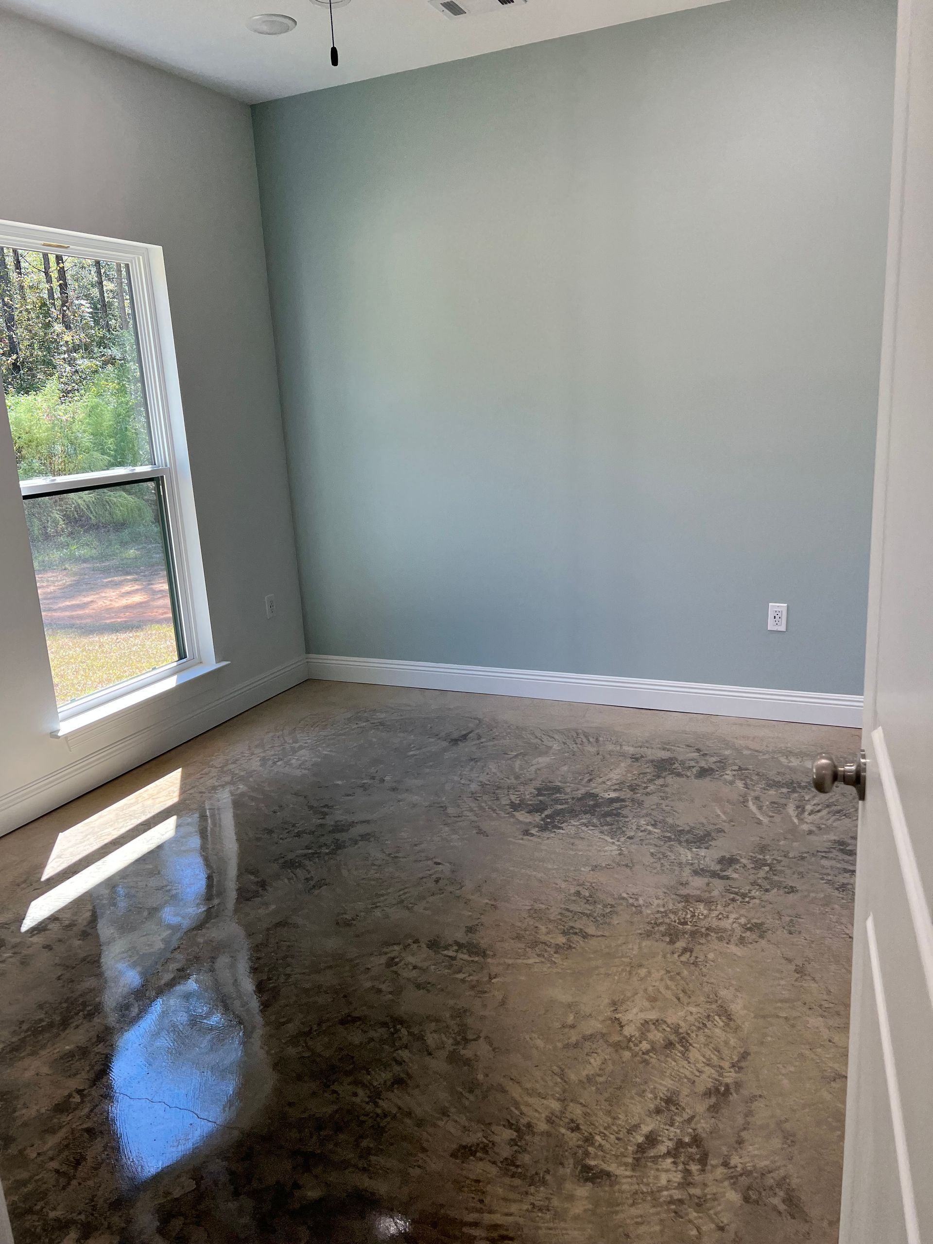Stained concrete floor by Jordan's Painting Mandeville