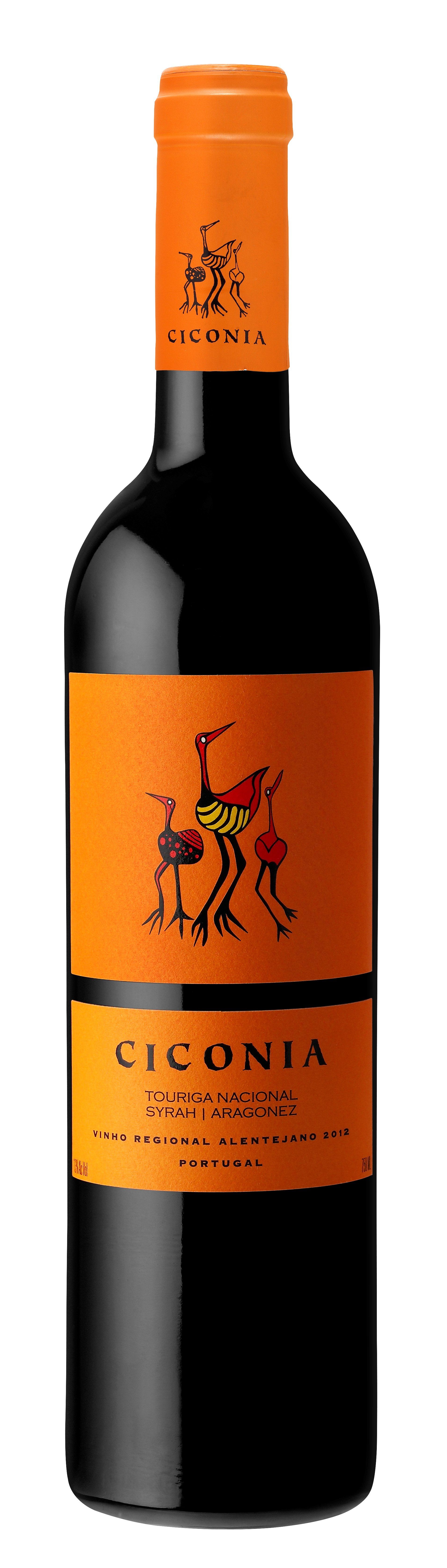 Wine bottle with orange label and cap. Label features stylized figures and the word 