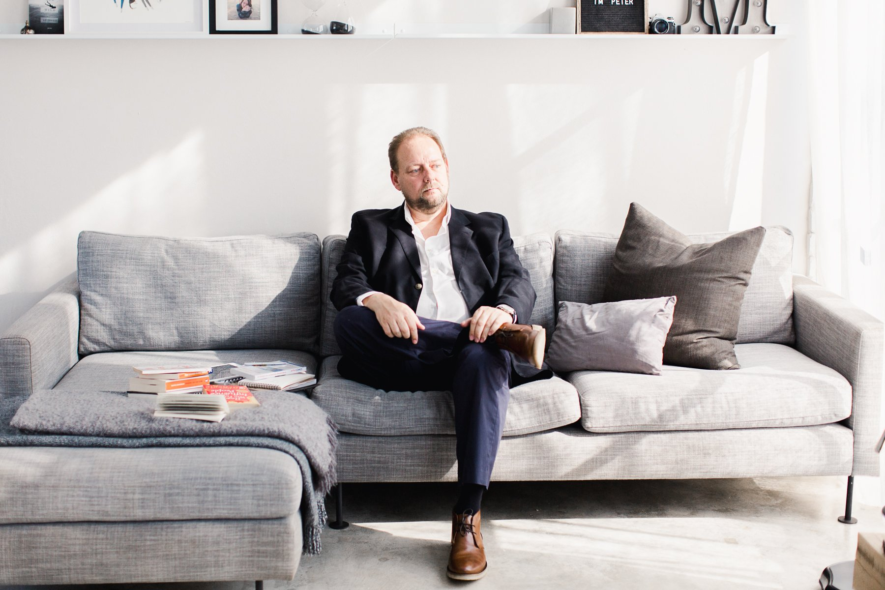 action coach Peter de lange on a couch profile photo