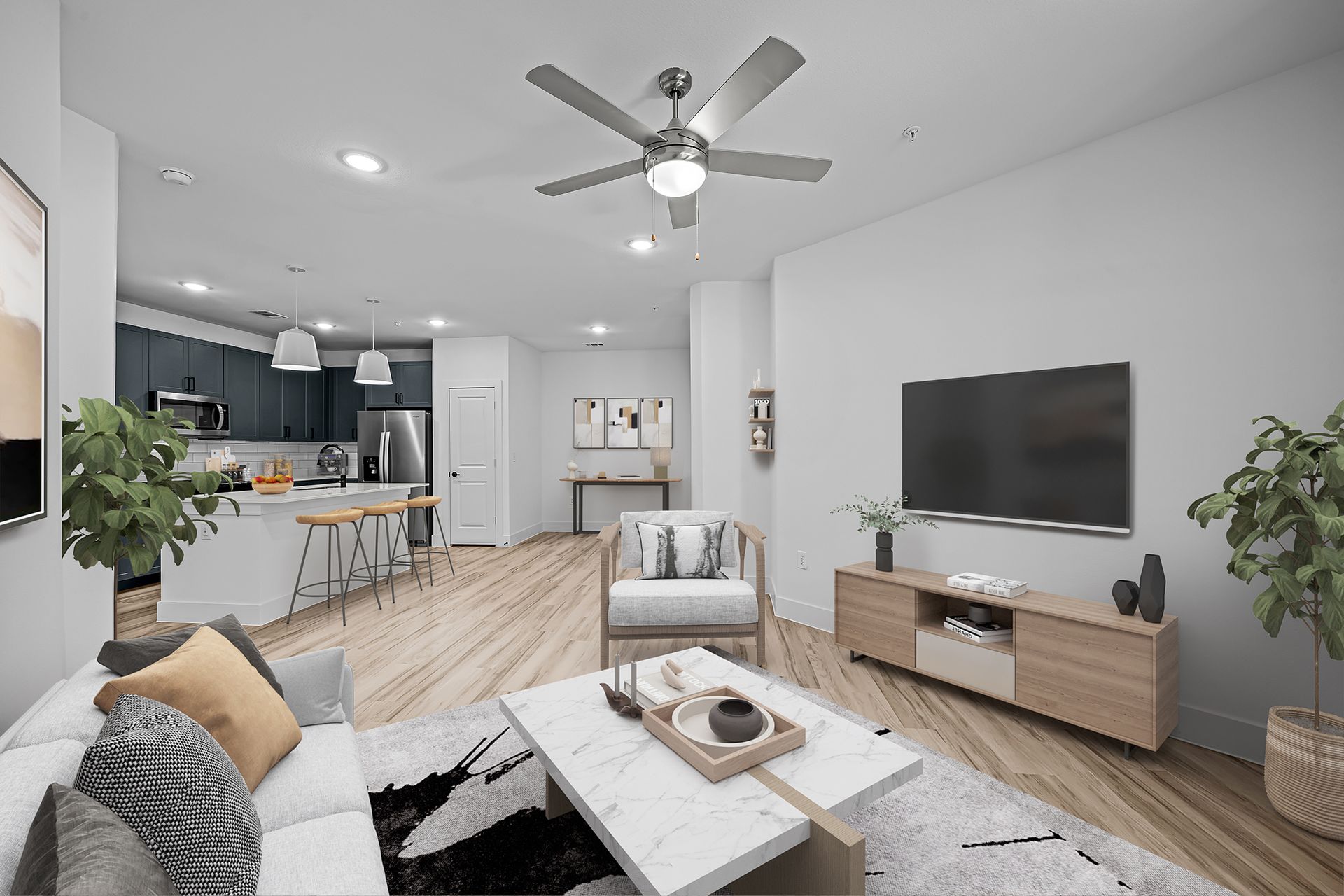 A living room with a ceiling fan and a flat screen tv.
