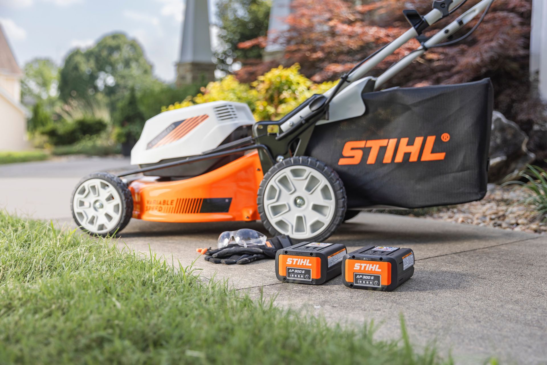 A Row Of Orange And White Stihl Lawn Mowers — Whitsunday Mowers In Cannonvale, QLD