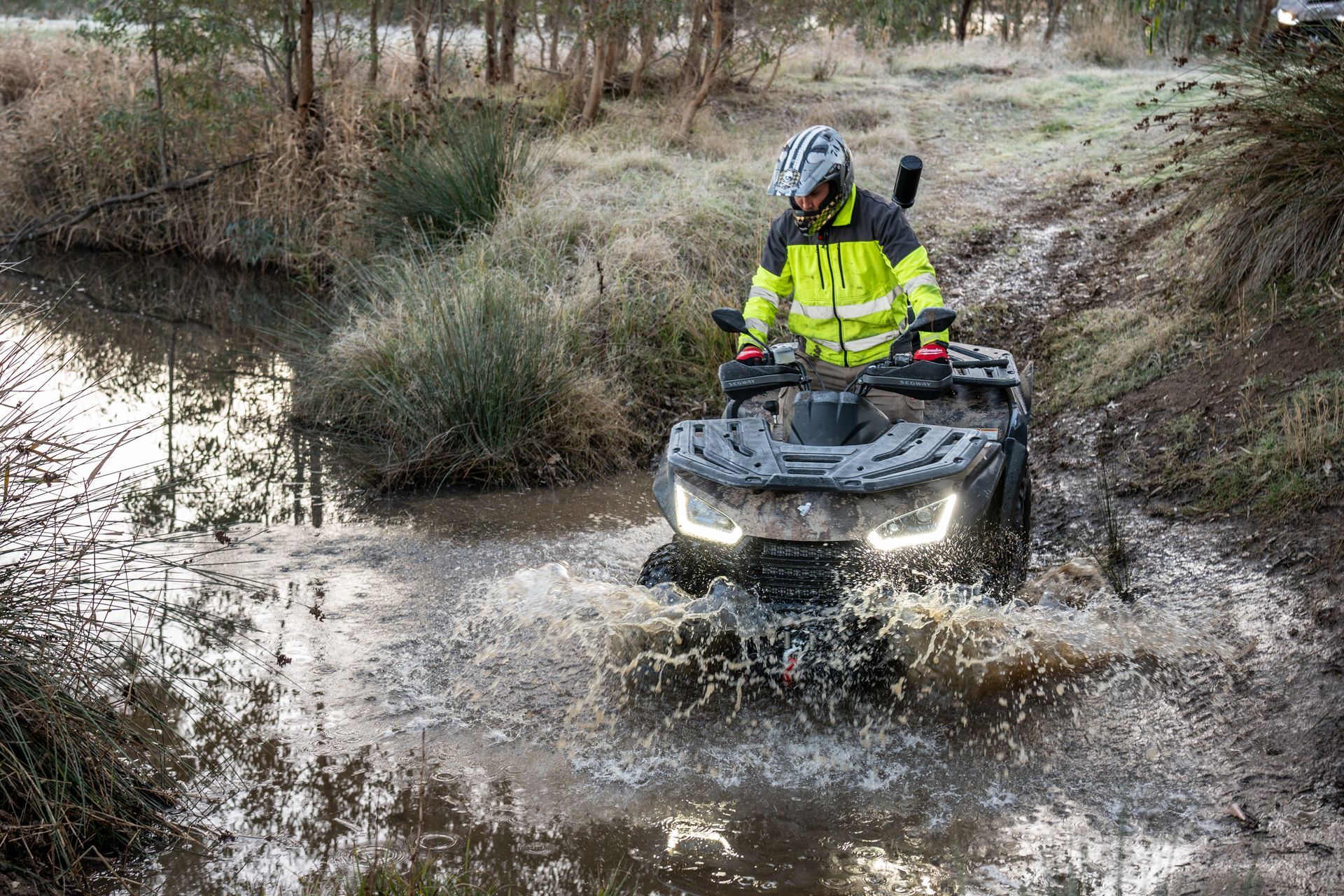 Off-Road Vehicle Driving in A Desert Setting, Kicking up Dust — Whitsunday Mowers In Cannonvale, QLD