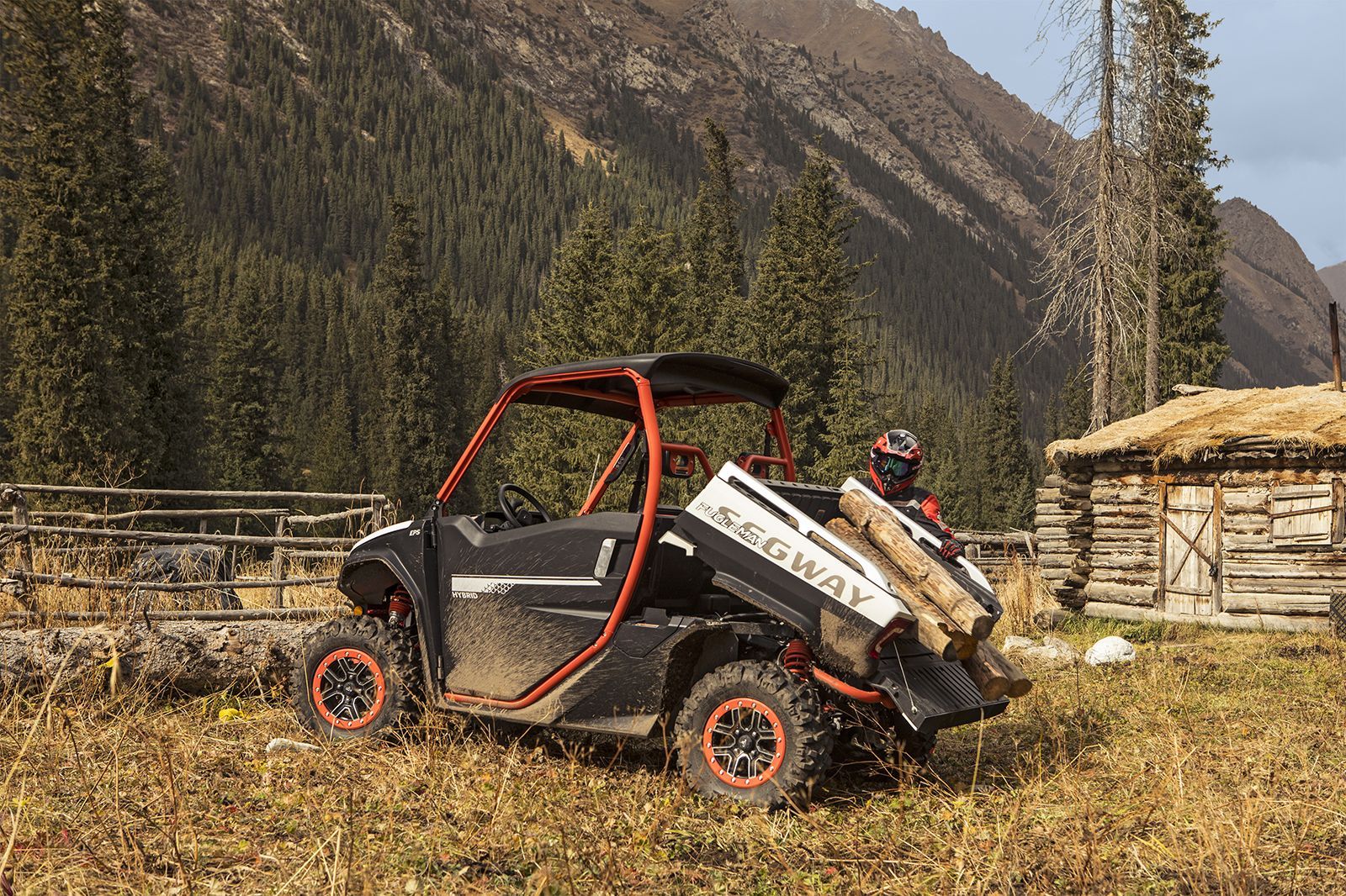 Side-By-Side Off-Road Vehicle Splashing Through a Shallow, Rocky Riverbed — Whitsunday Mowers In Airlie Beach, QLD