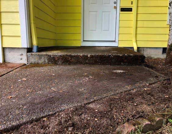 Yellow House With Even Concrete — Portland, OR — Concrete Leveling