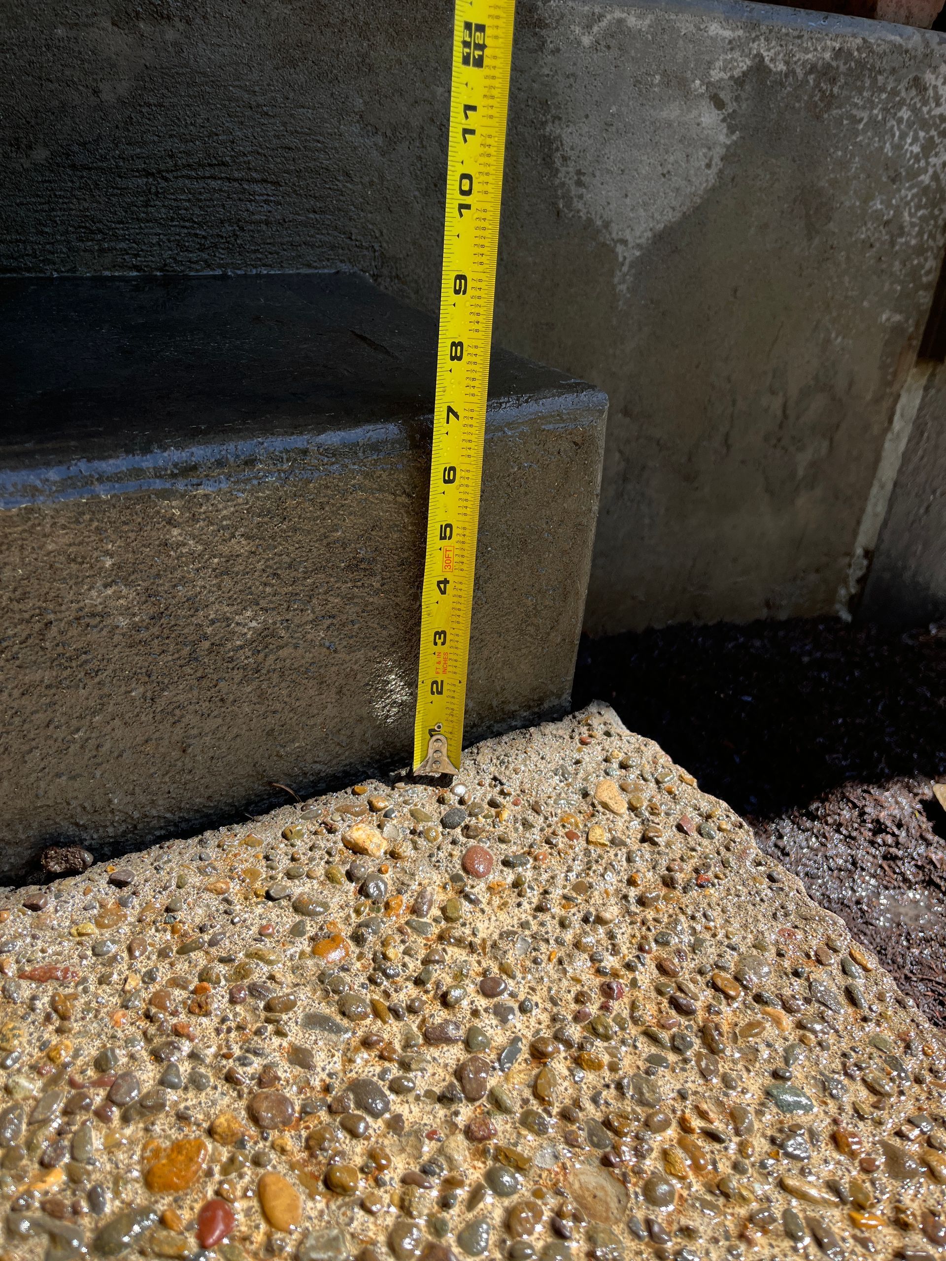 A Yellow Tape Measure Is Being Used To Measure A Concrete Surface - East Vancouver, WA - Keystone Mudjacking