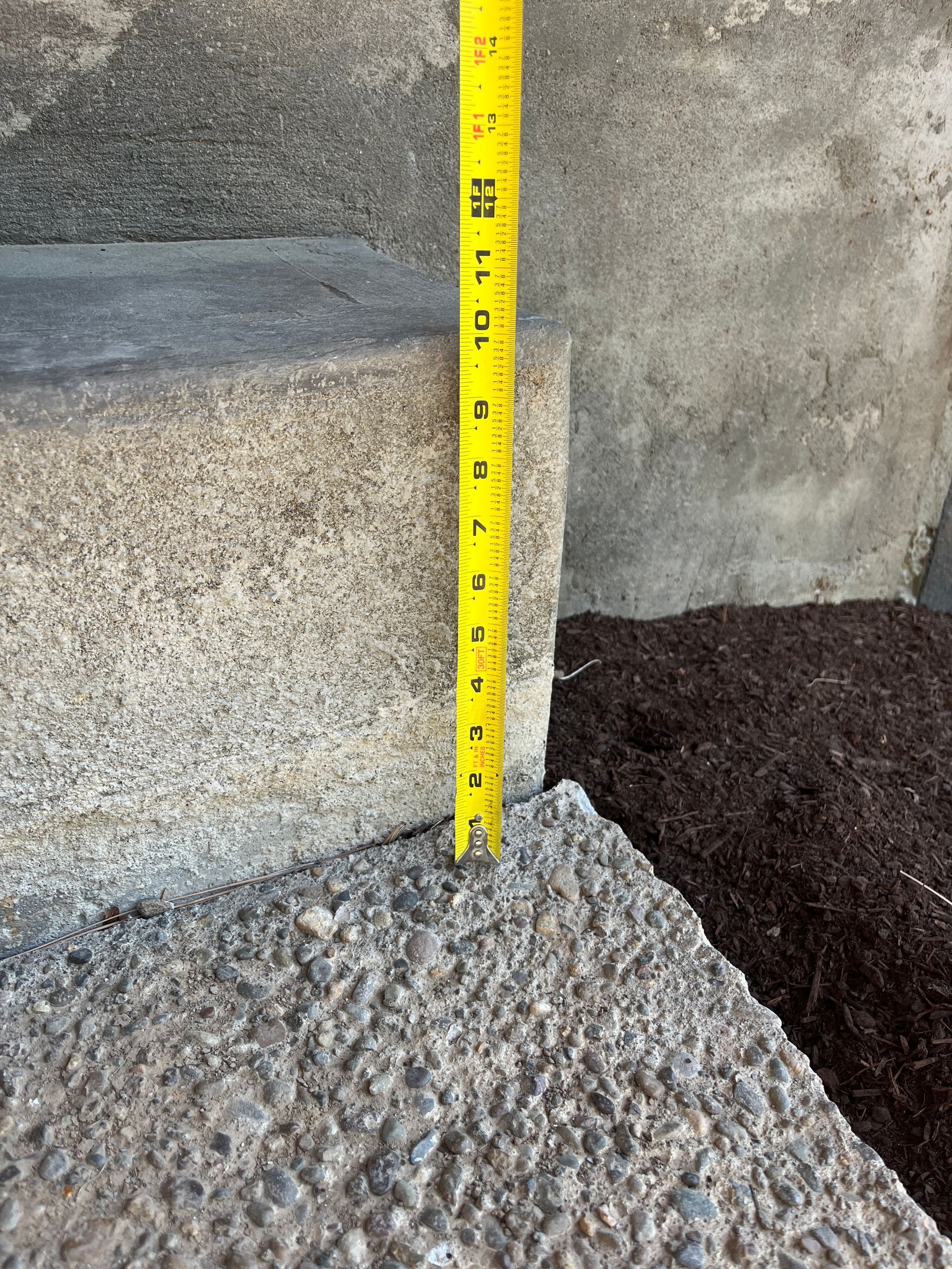 A Yellow Tape Measure Is Measuring A Concrete Block - East Vancouver, WA - Keystone Mudjacking