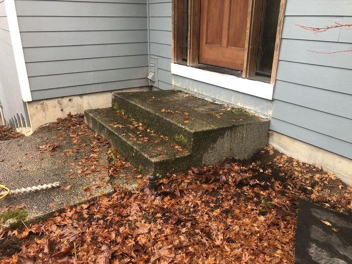 Yellow House With Even Concrete — Portland, OR — Concrete Leveling