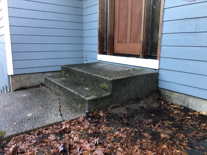 Yellow House With Even Concrete — Portland, OR — Concrete Leveling