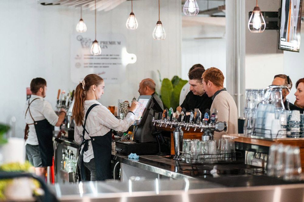 People Are Standing at a Bar in a Restaurant — Chop ‘n Chill Raby Bay in Cleveland, QLD