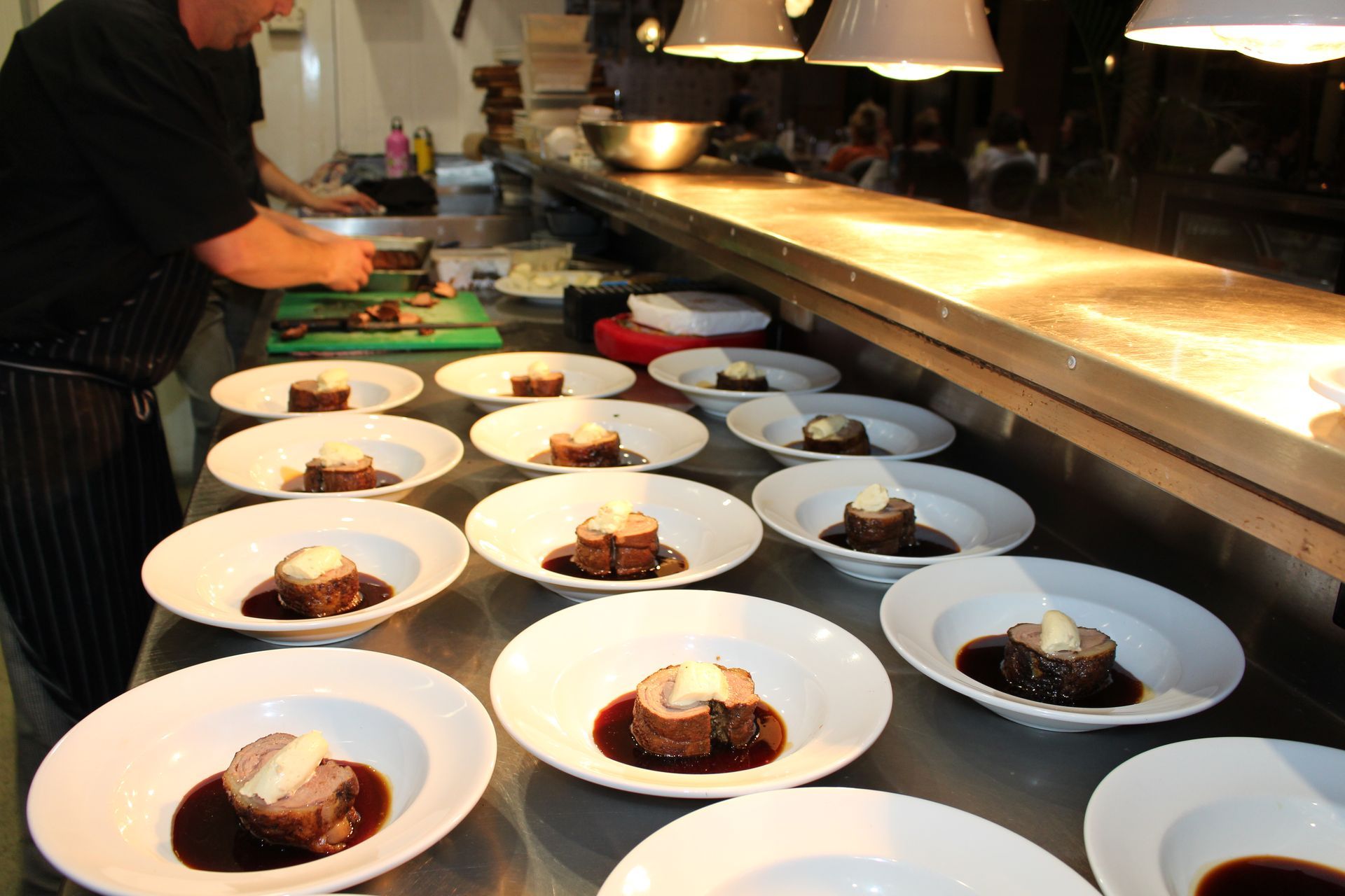 Chef Prepares Food on a Counter in a Kitchen — Chop ‘n Chill Raby Bay in Cleveland, QLD