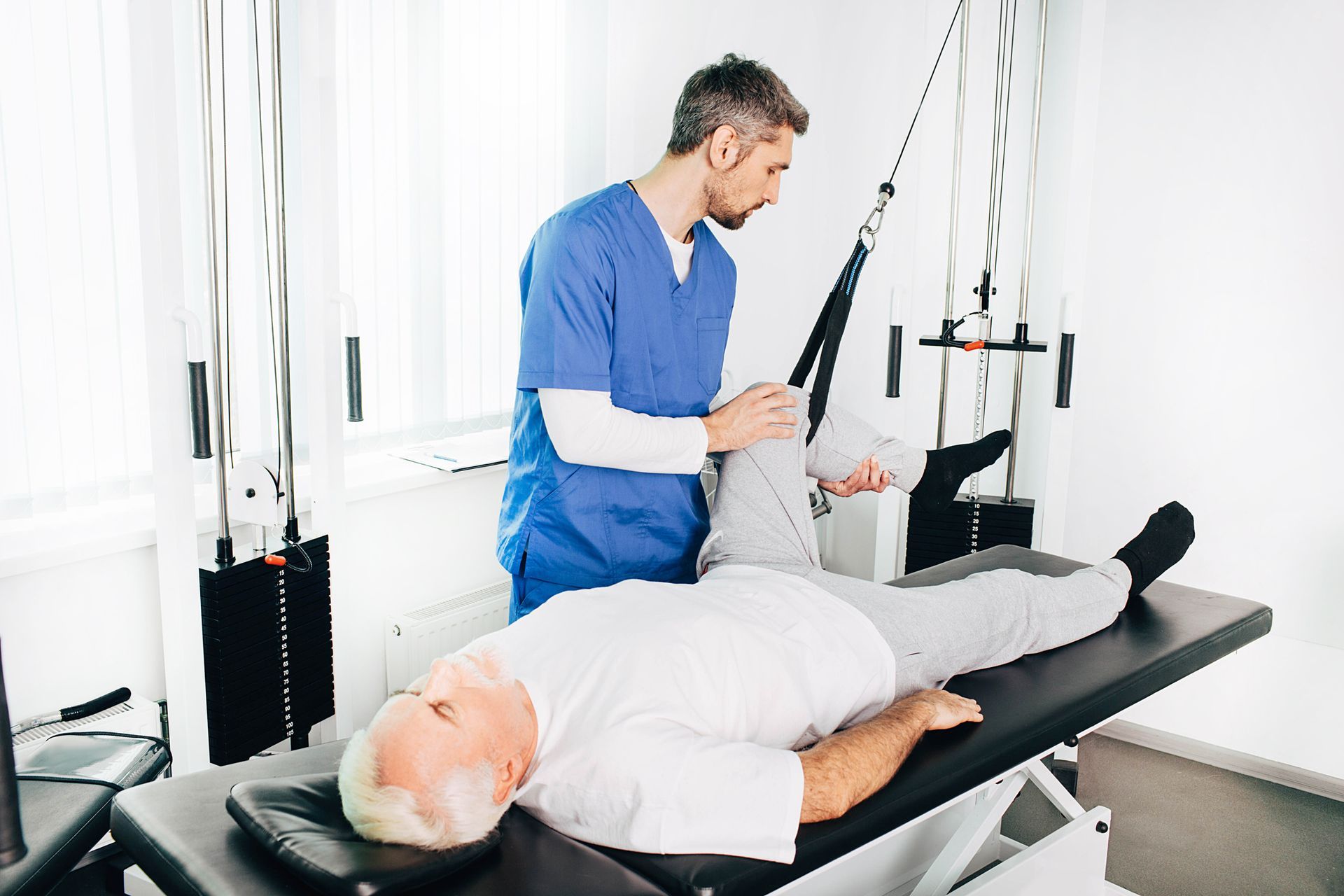 A man is sitting in the driver 's seat of a bus