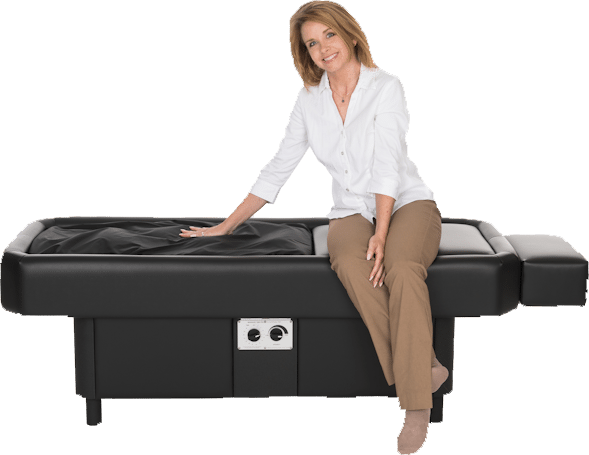 A man is laying on a bed with a headband on his head