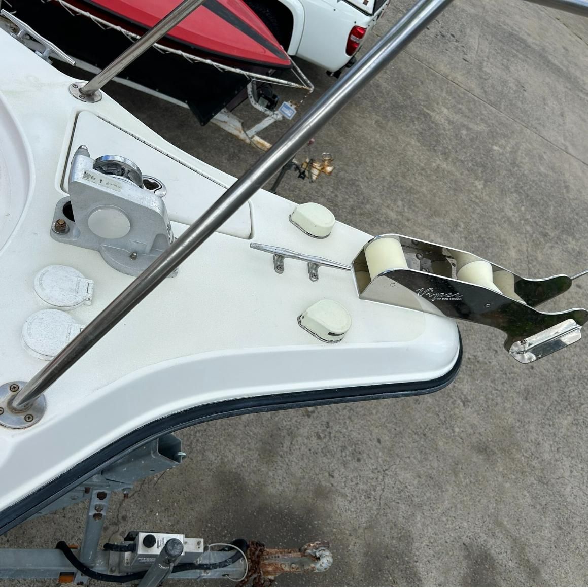 A White Boat With A Stainless Steel Anchor Attached To It — Murraycraft Fibreglass In Glenella, QLD