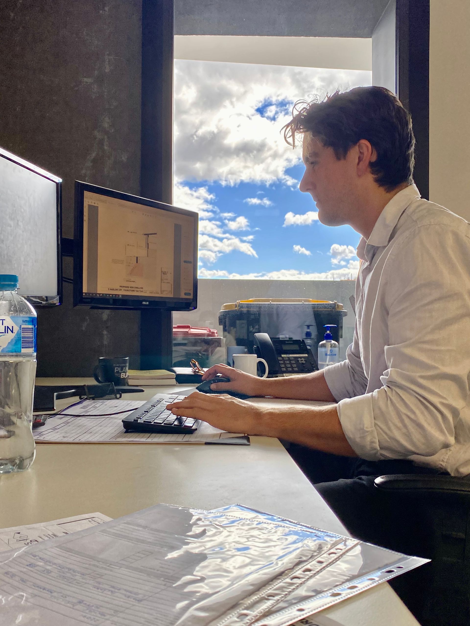Building designer Jackson at his desk