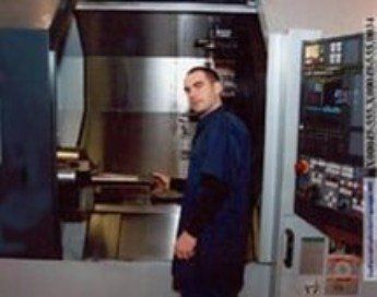 Worker Looking at the Camera — Propeller Manufacturing in Clinton Township, MI
