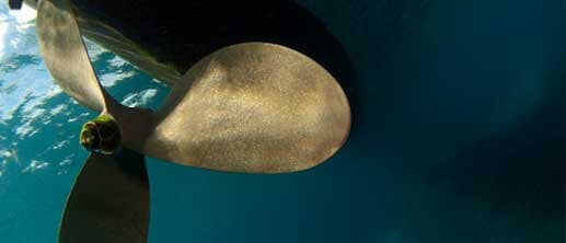 Underside of a boat propeller in water — Boat Shafting Company in Clinton Township, MI Underside of a boat propeller in water — Boat Shafting Company in Clinton Township, MI