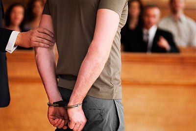 man in handcuffs in court