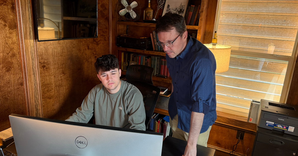 Zeke and Richard Grier working at Hard Hat Housing’s headquarters