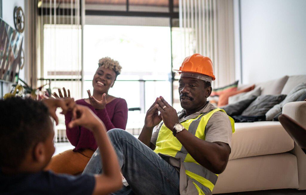 worker and family in a hotel room