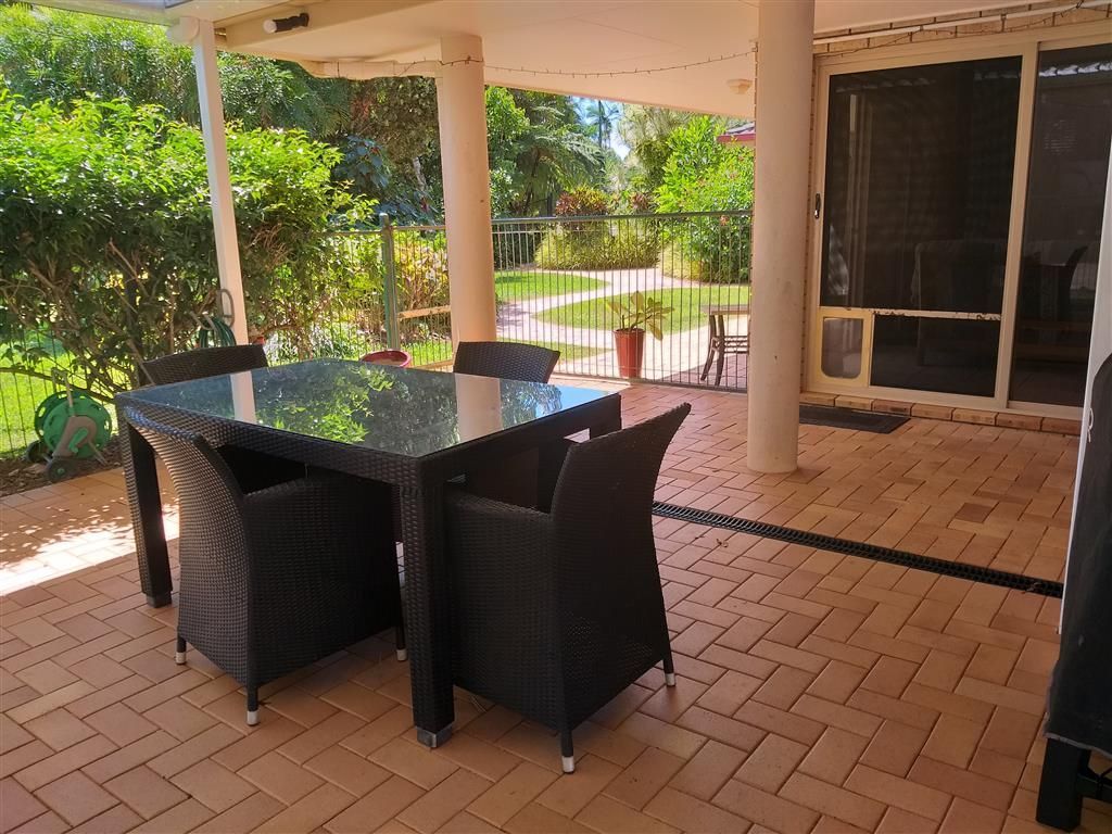 A Table and Chairs On a Patio— Mission Beach Property Management in Wongaling Beach, QLD