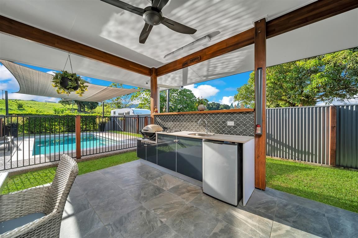 A pool and BBQ Out Door Setting— Mission Beach Property Management in Wongaling Beach, QLD