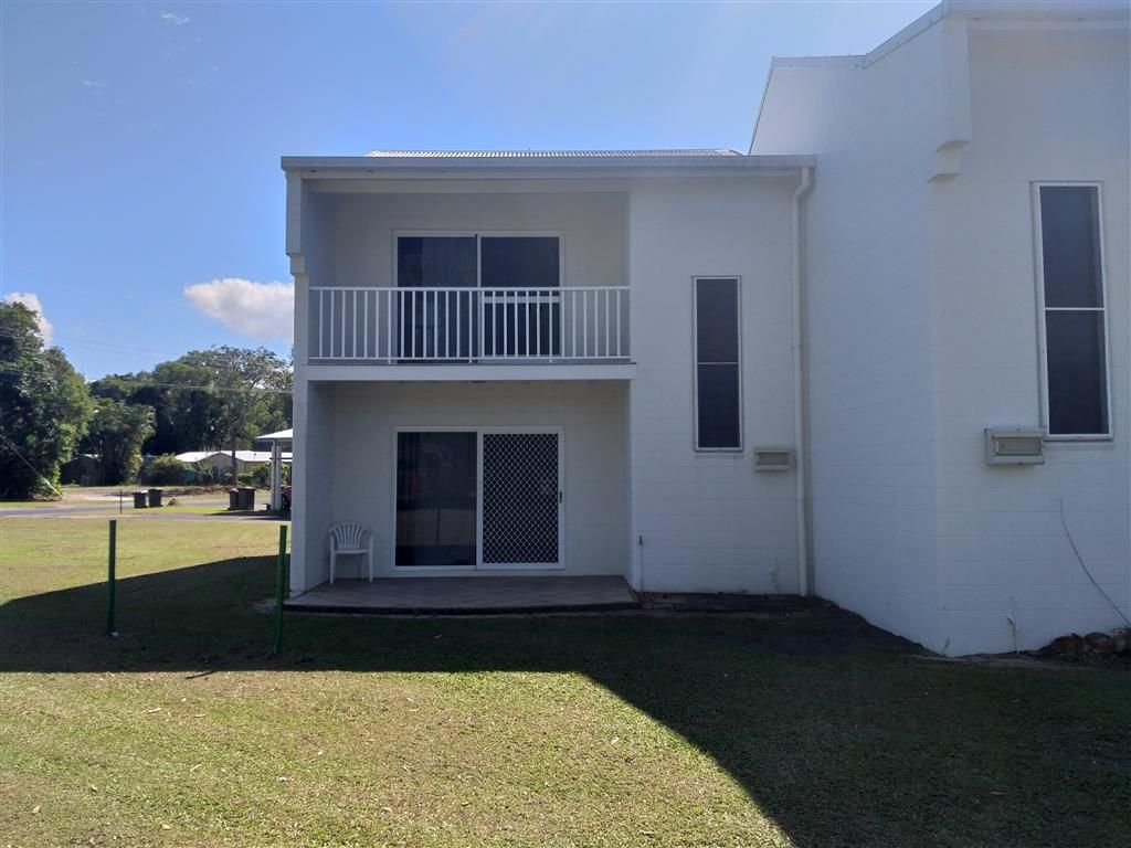 A Building With a Cloudy Sky in the Background — Mission Beach Property Management in Wongaling Beach, QLD