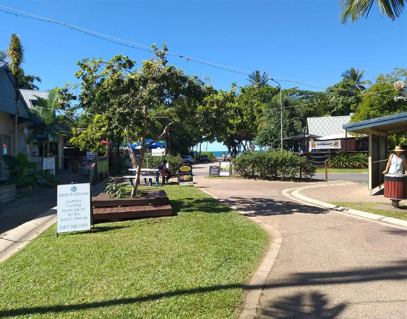 A Large Brick Building With a Lot of Windows — Mission Beach Property Management in Wongaling Beach, QLD