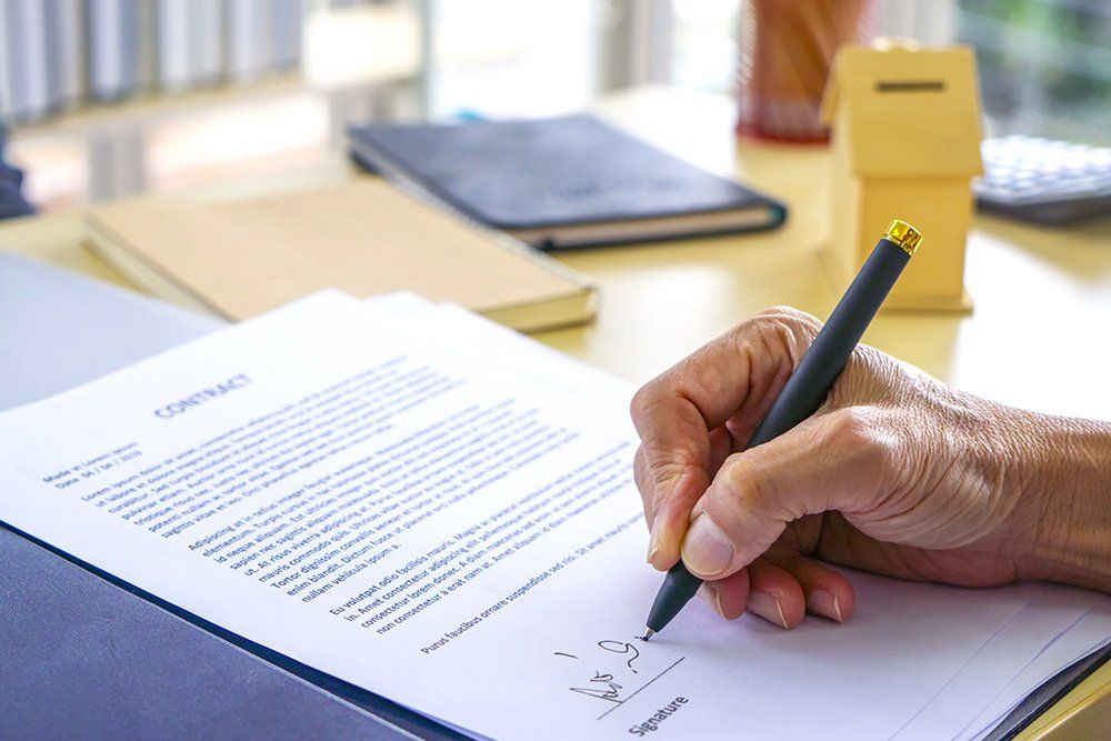 Signing Official Document | Laramie, WY | Brown & Hiser LLC