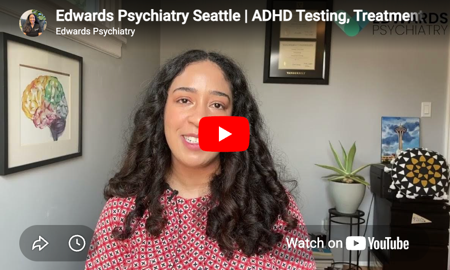 Woman speaking in a psychiatry video thumbnail, with a red play button and office background