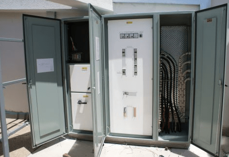 A large electrical box with the doors open and a sign that says ' emergency ' on it - Electrician in Emerald | All Saints Electrical