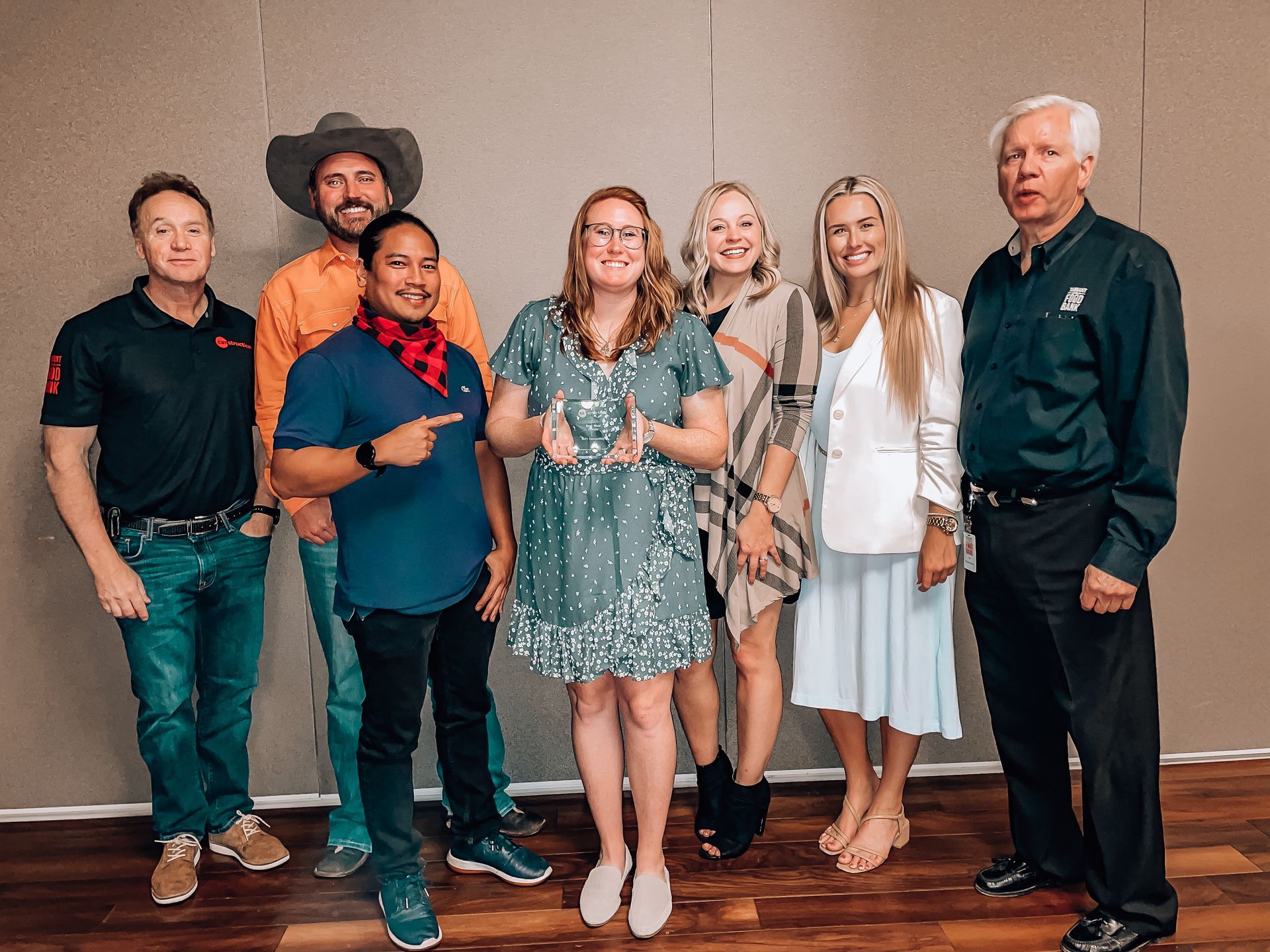 A group of people are posing for a picture together.