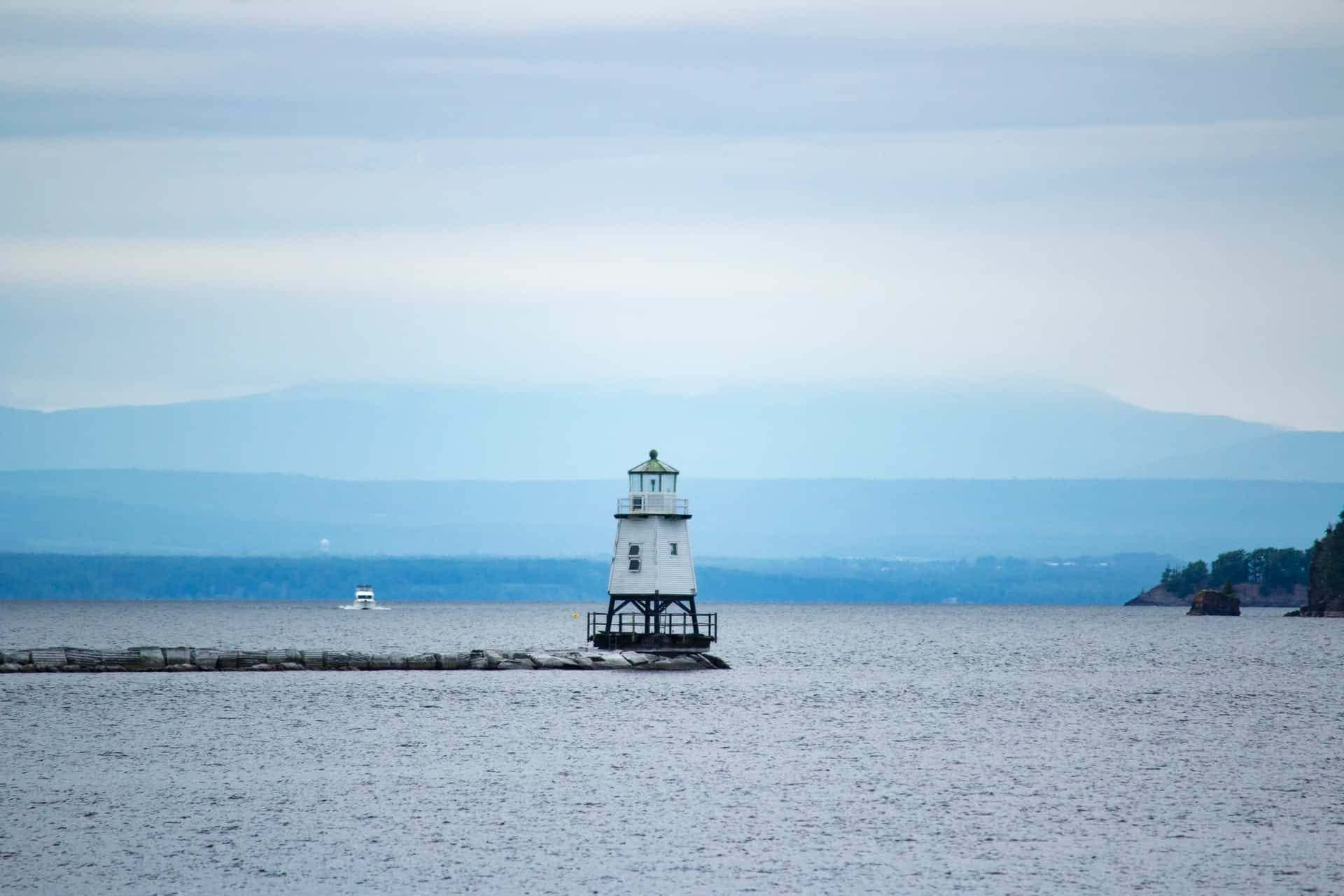 A lighthouse in the middle of a body of water