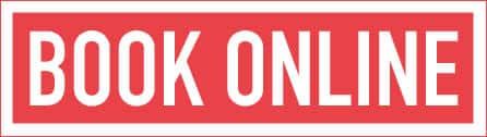 A red sign that says book online in white letters