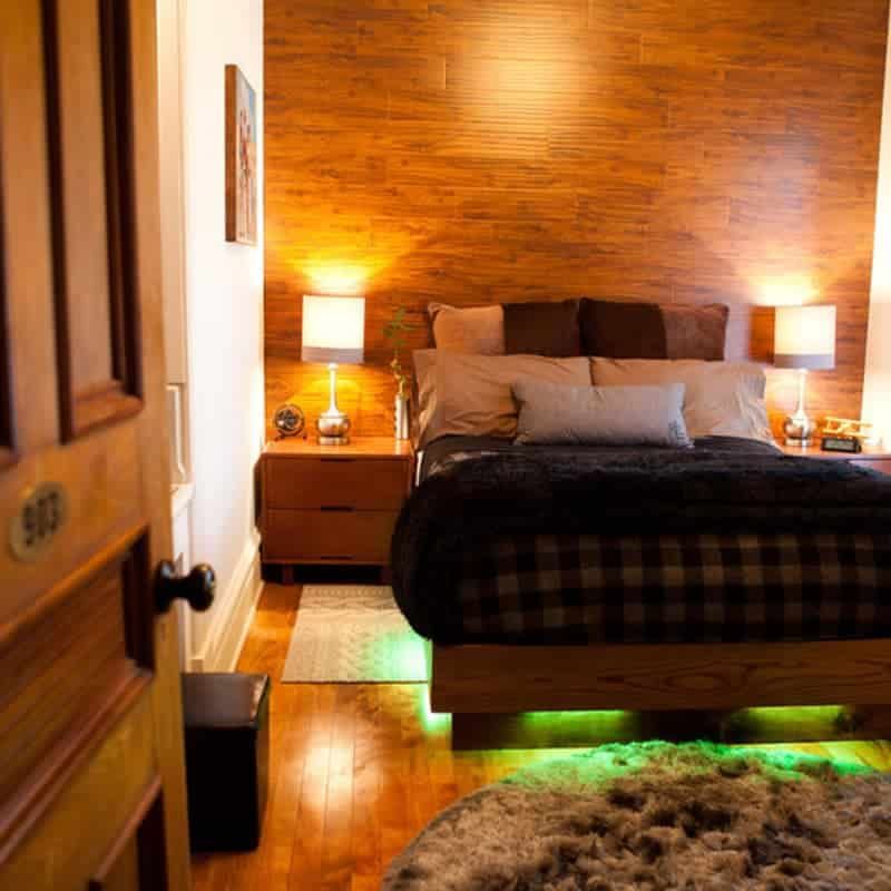 A bedroom with a bed and a door that has the number 400 on it