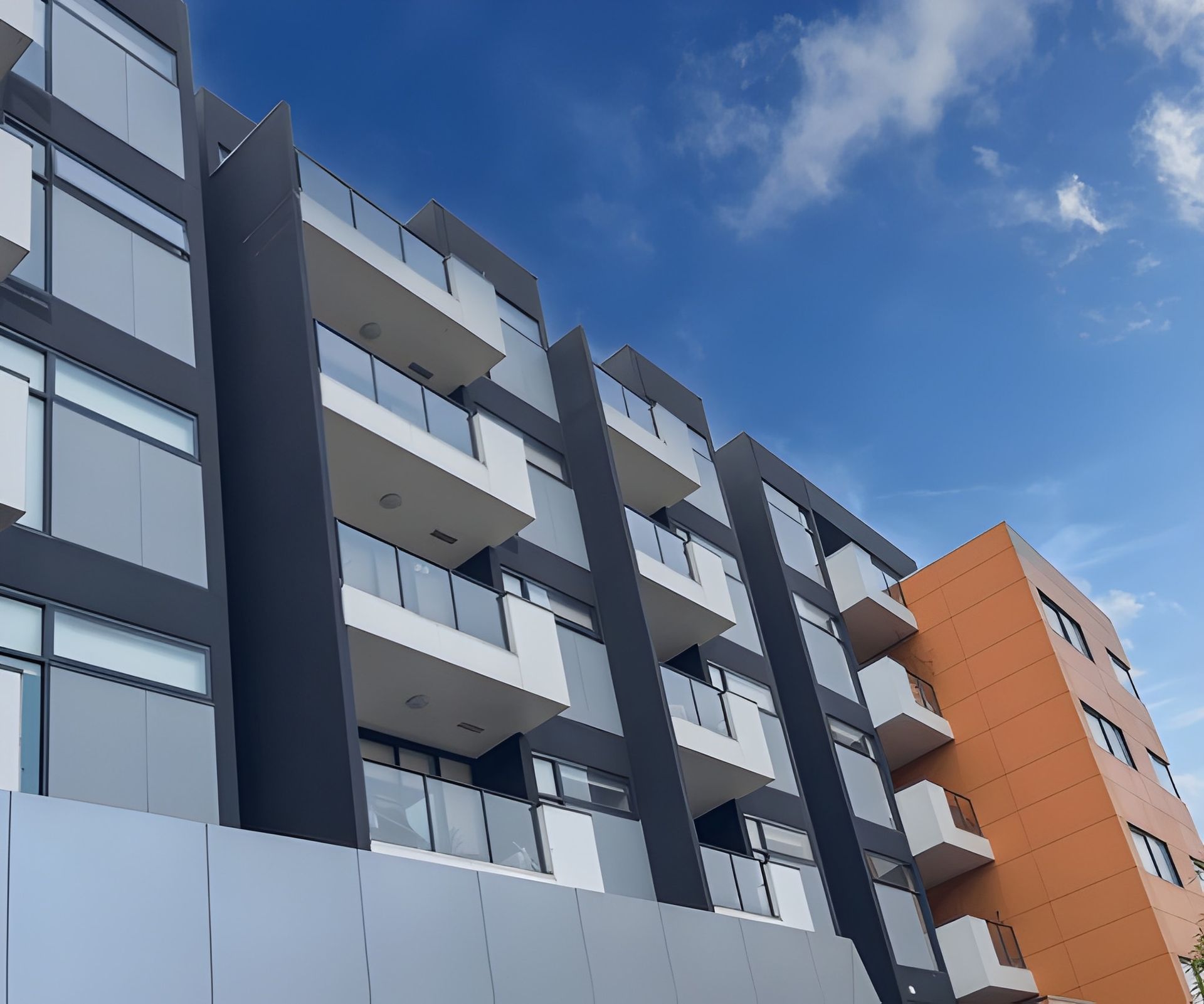 A restaurant with tables and chairs and a bar.